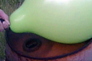 mch02. blowing up a giant green balloon. BOOM.