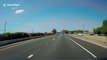 Low-flying airplane narrowly avoids cars on highway in California