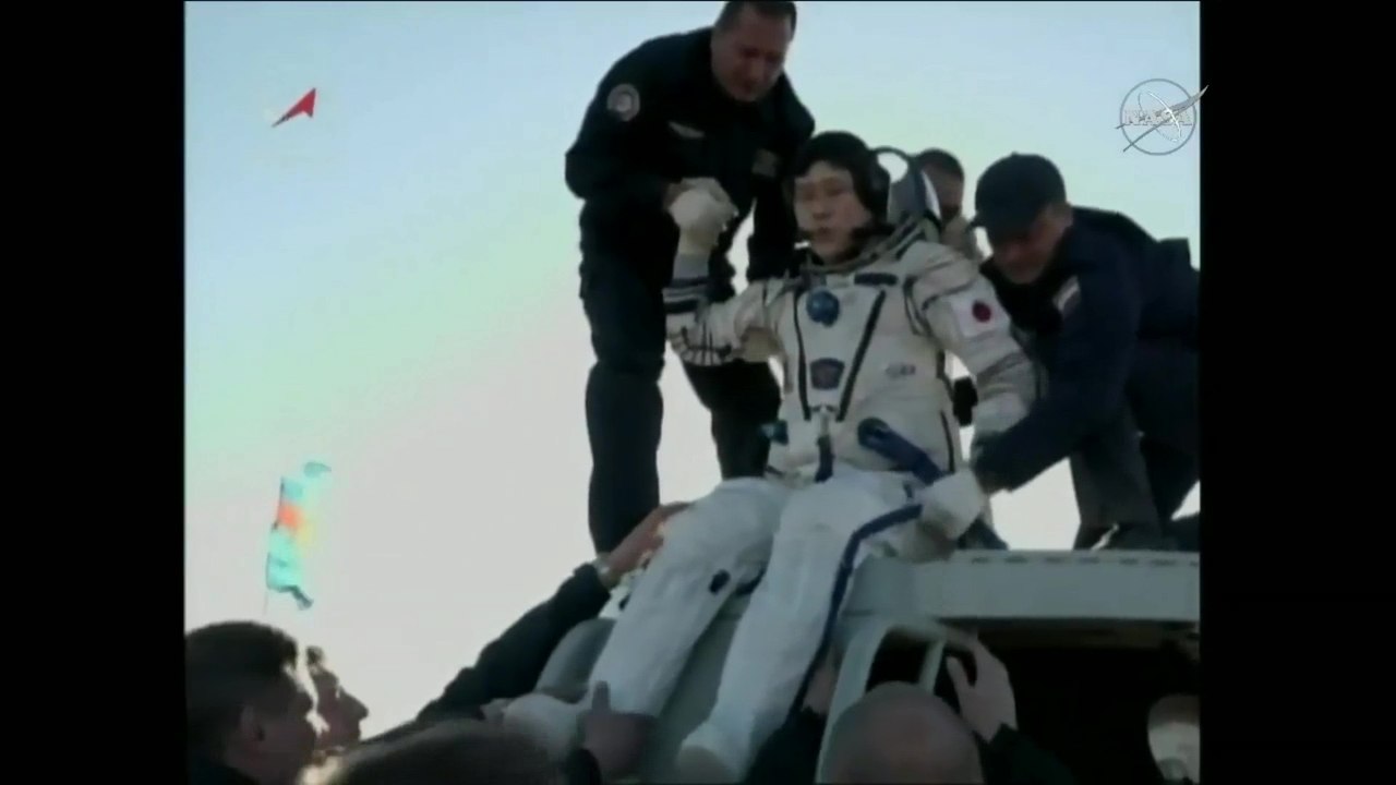 Crew Helped Out of Soyuz MS-07 after Landing