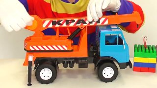 Crane helps toy truck transport LEGO. Toy video.