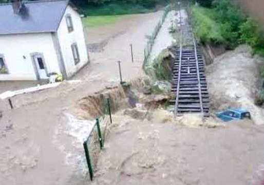 Car Swept Away and Rail Line Undermined by Raging Floodwater in France
