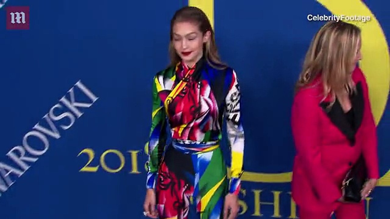 Gigi Hadid wears an 80's inspired colorful jumpsuit to the CFDAs