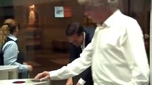 Dutch Prime Minister Cleaning The Floor Himself After Dropping The Coffee