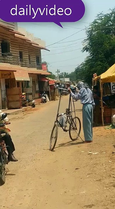 Funny One: Tallest Bicycle from India (May be in Word) - How he ride on it?