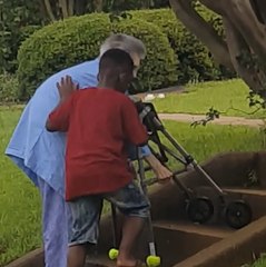 Download Video: 8-Year-Old Boy Helps Elderly Woman With Walker Up The Stairs