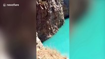 Flooded lime pond turns turquoise blue after continuous rain