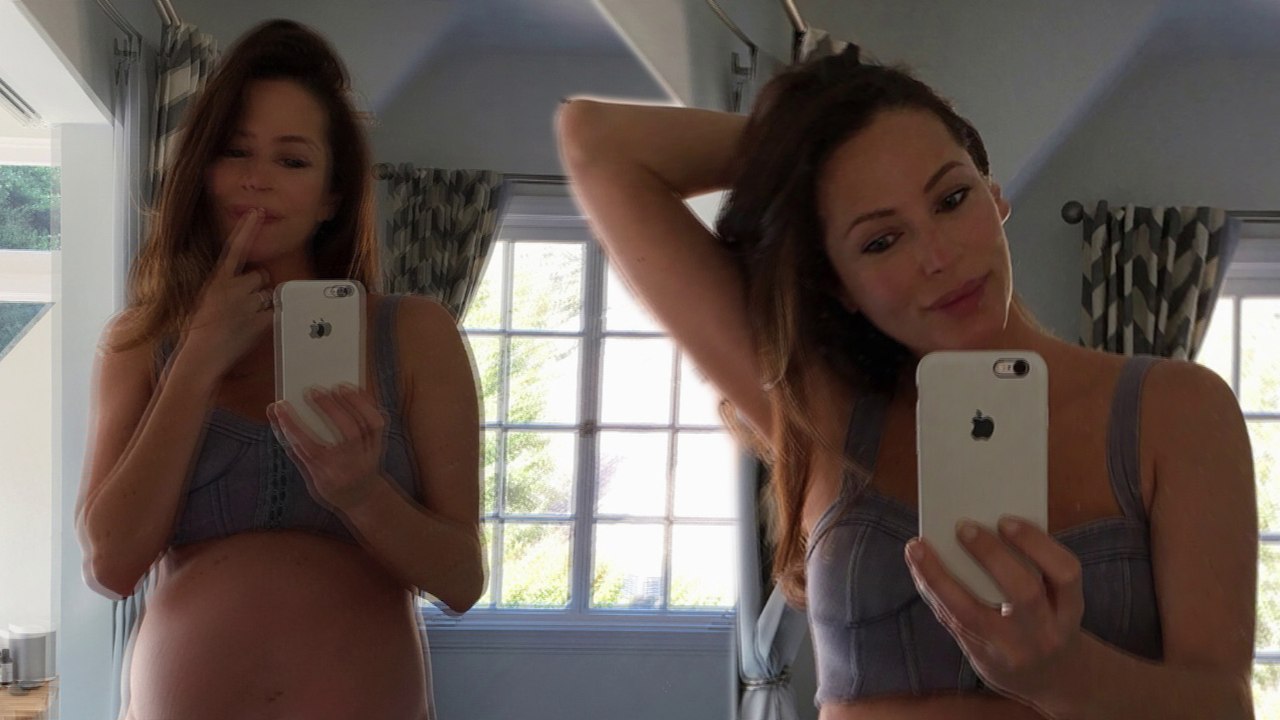 'Rounding out the day': Home And Away star Esther Anderson shows off her HUGE baby bump in a bikini after describing her pregnancy figure as 'all belly & boobs'