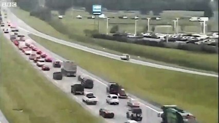 Car escapes traffic by driving in reverse