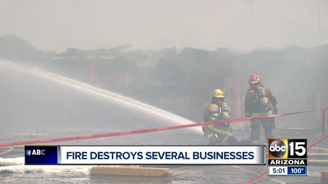 Fire destroys several businesses at Phoenix strip mall threatened homes