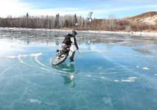 Brave Biker Performs Donuts on Frozen Lake