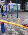 Old Asian Men Using Children’s Playground