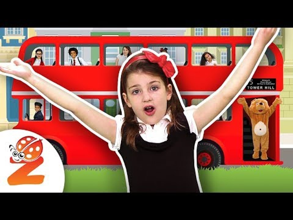 The Wheels on the Bus in England | #ZouzouniaTV Nursery Rhymes & Kids Songs