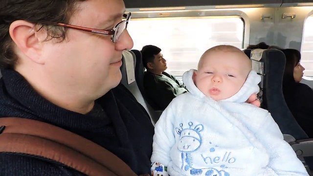 Baby Boy Makes Funny Faces On Train Ride