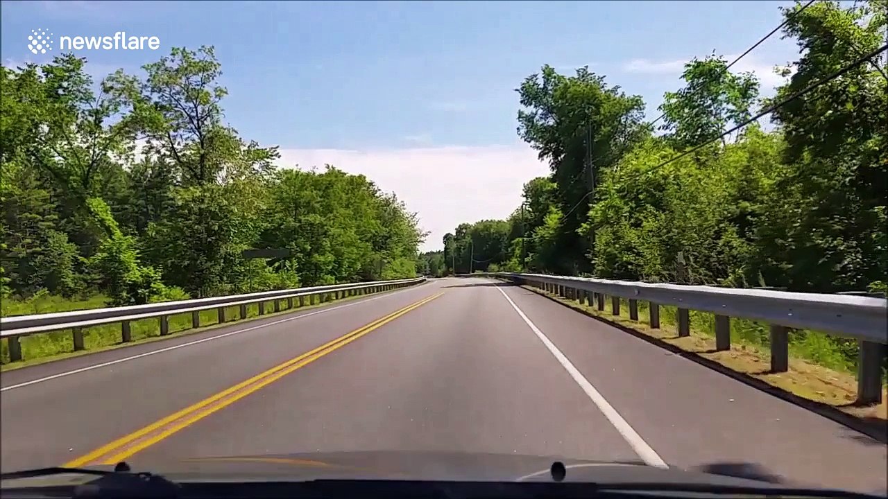 Dashcam captures near collision with pickup truck