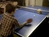 Little Boy Playing Ping-Pong With His Cat