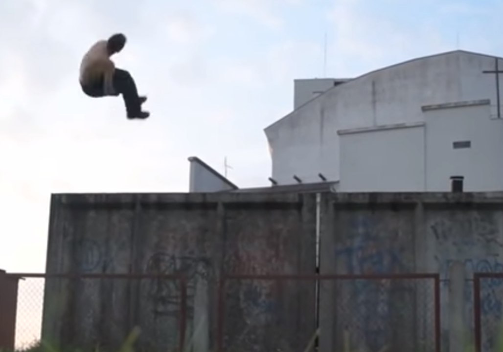 Daredevil Jumps Off a Two-Story Building in a Perfect Double-Sided Flip