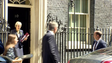 Theresa May departs Downing Street ahead of PMQs