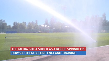 Behind the Scenes - Media get soaked at England training