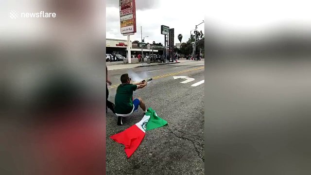 Man launches firework at police officers as World Cup celebrations in east LA turn violent