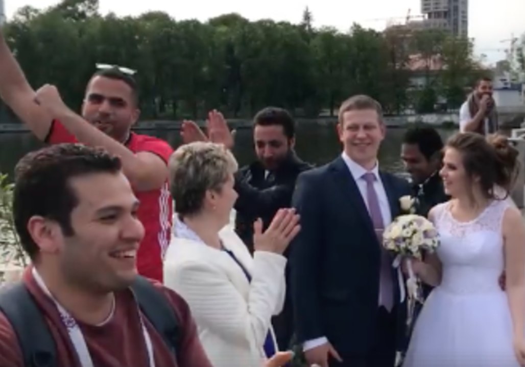 Egyptian World Cup Fans Dance and Sing Around Russian Newlyweds