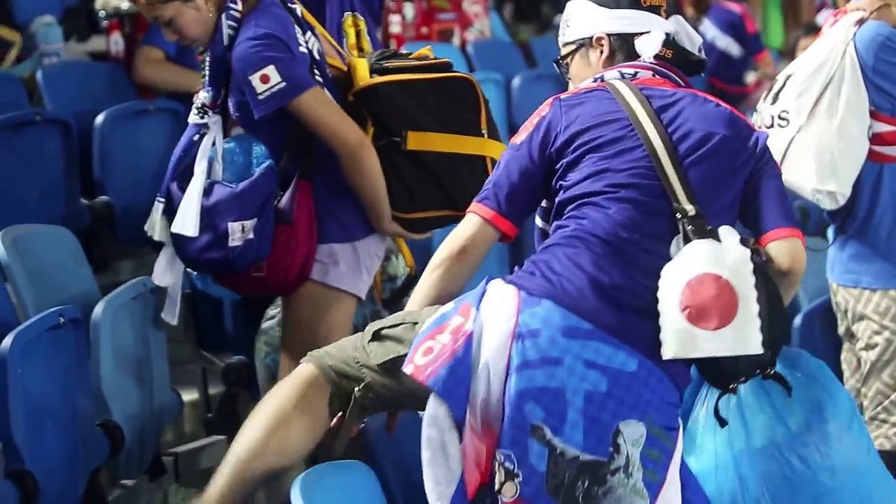 Japanese fans pick up trash after World Cup match..