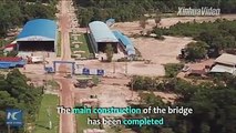 The main construction work of Laos's longest bridge is completed. It is built by a Chinese firm. Click for more details.