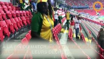 Les supporters du Sénégal et du Japon nettoient les gradins après le match
