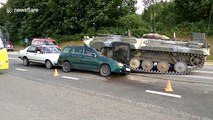 Tank crushes car in Belarus