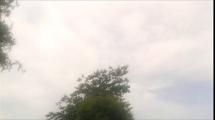Slow Moving Clouds across the Sunny Sky