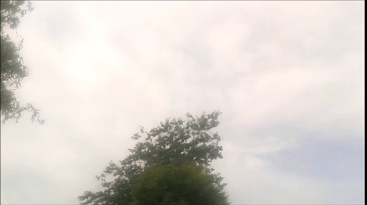 Slow Moving Clouds across the Sunny Sky