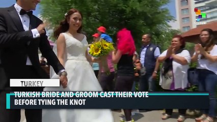 Turkish Couple Cast Their Vote in Wedding Outfits