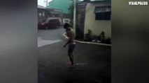 Teenager Plays Basketball Through Storm