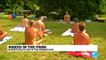 Paris: Naked in a park, Parisian nudists enjoy a hot day in the sun