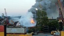 Massive plumes of smoke billow over huge barge fire in South Seattle