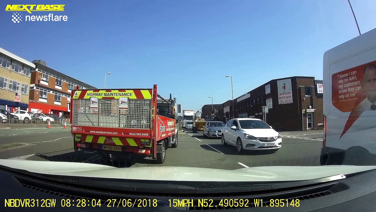 Motorcyclist ends up in truck's bed after side-on collision