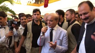 Shehbaz Sharif sings alongwith the singer performing in the hotel lobby _ Facebook-HD