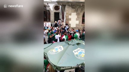 Ecstatic Mexico fans hoist up Korean fan after South Korea win