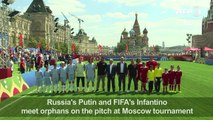 Putin, Infantino kick off football tournament for orphans