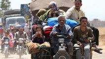 Civilians flee fighting in southern Syria