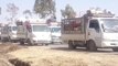 Convoy of Trucks Carry Displaced People Out of Northwest Daraa City