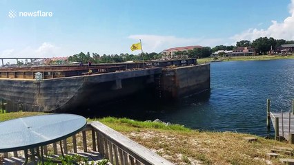 Barge smashes into wooden dock in Perdido Key, Florida