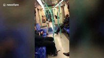 Half-naked man oils himself up then pole-dances on the London Tube