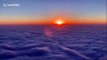 Gorgeous time-lapse shows sunrise over clouds roiling like waves