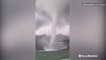 Onlookers watch in awe as massive tornado spins nearby