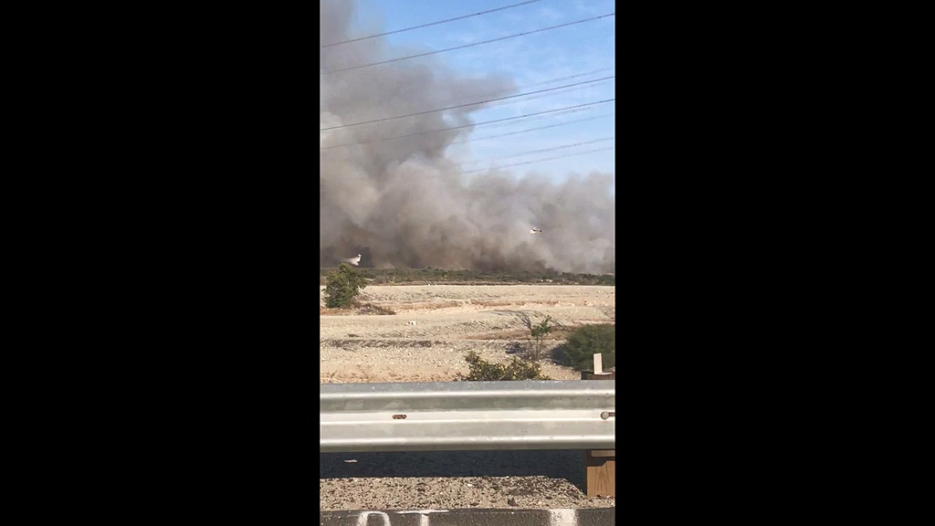 Brush fire breaks out near dam outside Los Angeles