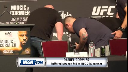 Daniel Cormier suffers strange fall at presser