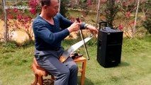 Chinese man uses musical saw to play Japanese ballad