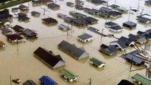 Japan floods: Death toll rises as PM warns of 'race against time'