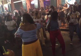 New Orleans Festivalgoers Do the Electric Slide on Bourbon Street
