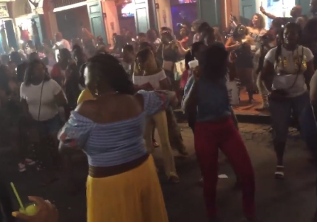 New Orleans Festivalgoers Do the Electric Slide on Bourbon Street